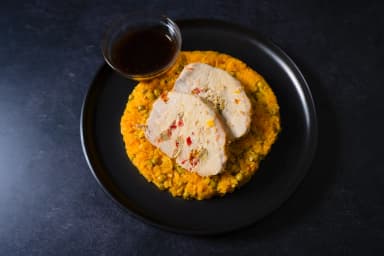 Pork dyon and yellow cauliflower rice with peas