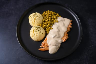 Chicken stragonoff with mashed potatoes and peas