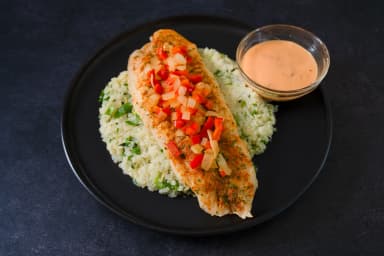 Breaded fish with cauliflower rice and cilantro