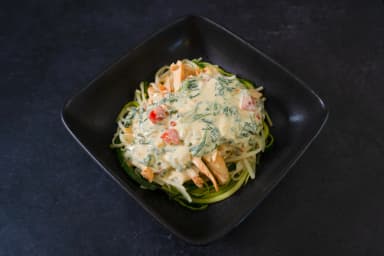 Vegetable pasta with chicken in cottage sauce and spinach