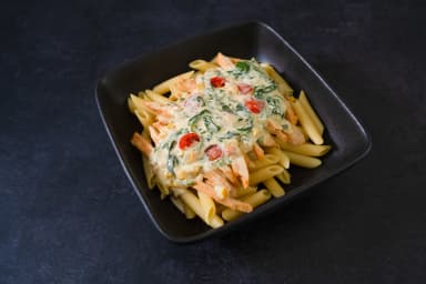 Pasta with chicken in cottage sauce and spinach