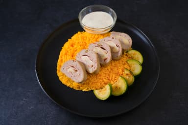 Turkey roll with yellow rice and sautéed zucchini